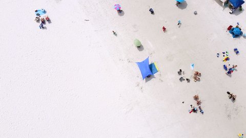 Above Aerial of people enjoying  Siesta Key public beach in Sarasota Florida