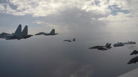 CIRCA 2021 Aircraft from Carrier Air Wing 11 and Royal Malaysian Air Force fly above Theodore Roosevelt Carrier Strike Group.