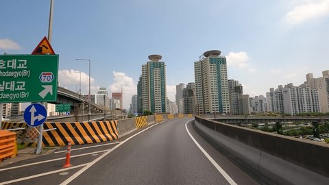 Seoul , South Korea - 06 27 2021: Cars traffic on highway on sunny day in Seoul 