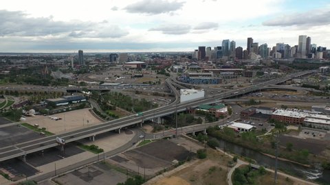 Aerial View of Freeway Traffic Outside Downtown Denver, Colorado USA Under Dramatic Sky, Drone Shot