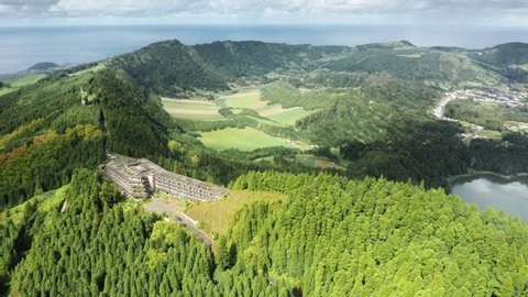 SAO MIGEL ISLAND, AZORES, PORTUGAL-14 MAY, 2021: Drone flying over Monte Palace hotel ruins on top of mountain, Cerrado das Freiras, Sao Miguel island, Azores, Portugal, 4k footage with copy space
