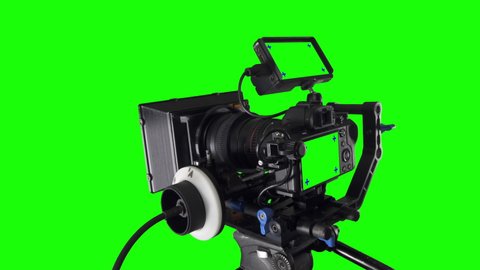 Professional Filmmaking Cinema Camera Rig isolated on green screen chromakey background with pretracked  monitors with trackers added for easy one click keying and replacement.