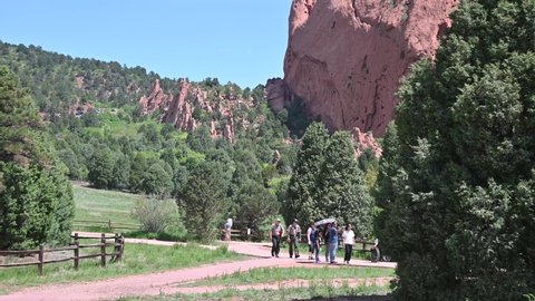 Colorado Springs, CO USA: Circa June 2021
People visiting Garden of the gods. A disabled person in a wheelchair along with other people is using the fine walkways to tour the park.
