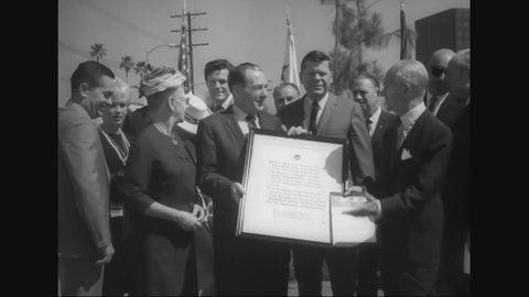 CIRCA 1966 - MCA president Jule Styne and Mayor Yorty attend a ceremony honoring the beautification of Lankershim Boulevard in Los Angeles.