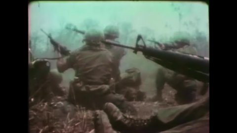 CIRCA 1960s - American soldiers shoot machine guns and other firearms in Vietnam.