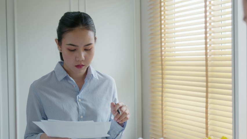Young female leader, asia people lady or mba student standing look in front of mirror fear tired pep talk for sale pitch hold paper document script public speak skill for job career lost self improve. Royalty-Free Stock Footage #1075124117