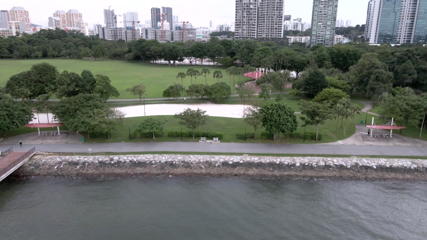Aerial View Of People At Promenade Lookout Jetty - Observation Deck at West Coast Park In Singapore. - sideways