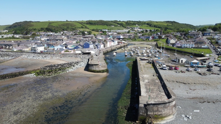 Aberaeron Wales seaside town and harbour with tide out Aerial footage 4k
