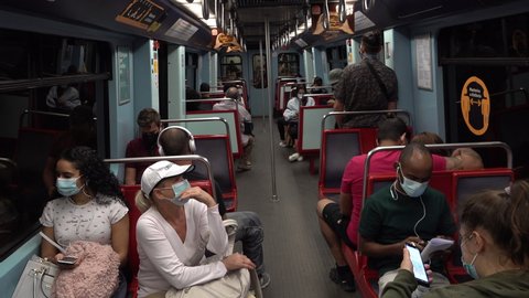 LISBON, PORTUGAL – 4 JUNE 2021: People wear face masks in the metro of Lisbon, Covid-19 coronavirus measures on public transport system in Portugal
