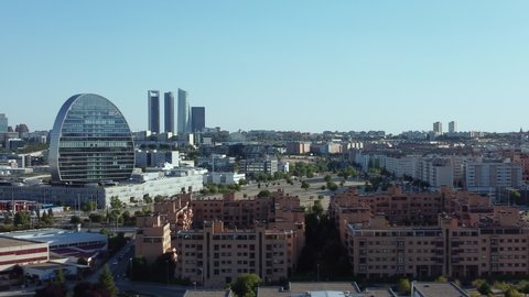 Madrid, Spain - June 24, 2021: Aerial drone view of Madrid skyline from the northern suburbs of Las Tablas facing south towards the BBVA building and Cuatro Torres financial district