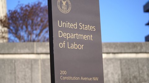 Washington, DC, USA - February, 11, 2021: United states Department of labor building sign on Constitution Avenue. 