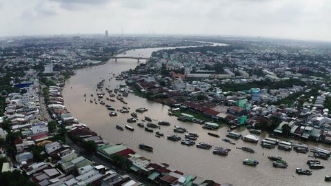 Aerial Shot Of Boats On Canal Against Sky In City, Drone Flying Forward Over Floating Market - Ho Chi Minh City, Vietnam