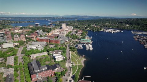Seattle Washington University District Aerial View on Sunny Day. Drone view of of modern city park along the lake in Pacific Northwest