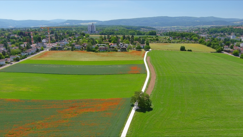 Basel: Aerial view of city in Switzerland at border with France and Germany, city outskirts with modern residential buildings, clear blue sky - landscape panorama of Europe from above