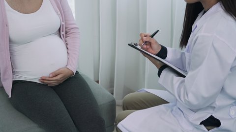 Pregnant women are consulting a psychiatrist about stress and mental conditions during pregnancy. Doctors are monitoring health of pregnant women. concept consulted about childbirth preparation.