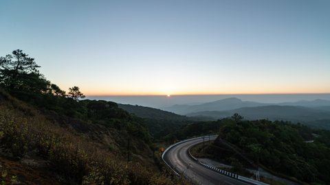 Timelapse of the night to sunrise over the Mountains at Doi Inthanon Chiang Mai, Thailand.	
