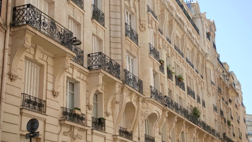 Typical Parisian Building With Balconies And Windows. Haussmann Style Architecture Along 16th Arrondissement In Paris, France. low angle, side view | Shutterstock HD Video #1075173908