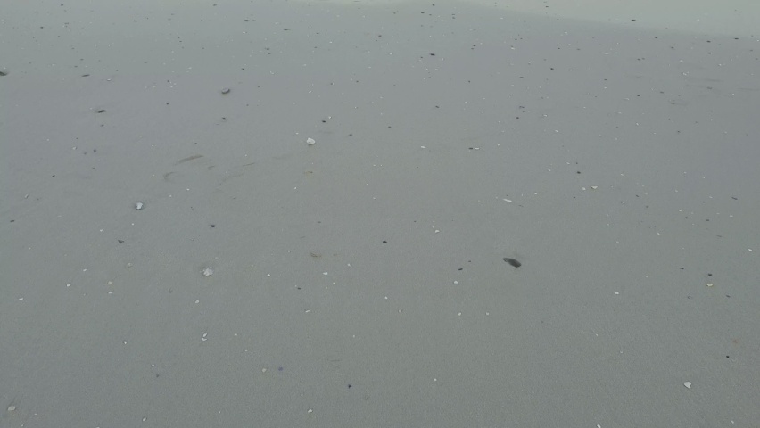 Panning over Robben island in Cape Town, South Africa from Bloubergstrand on a summer morning during sunrise