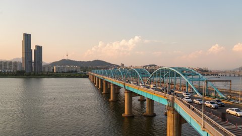 Seoul,South Korea-June 21,2021: Timelapse 4k Aerial view of Seoul City and Korea railway at Han river in South Korea.