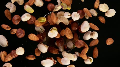 Super Slow Motion Shot of Rotating Various Nuts, Filmed on High Speed Cinematic camera at 1000 fps.