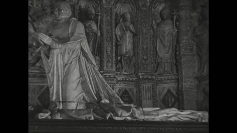 1940s: Statues of women and Louis de Breze on elaborate tomb in cathedral. Statues stand on the tomb of Cardinal of Amboise.
