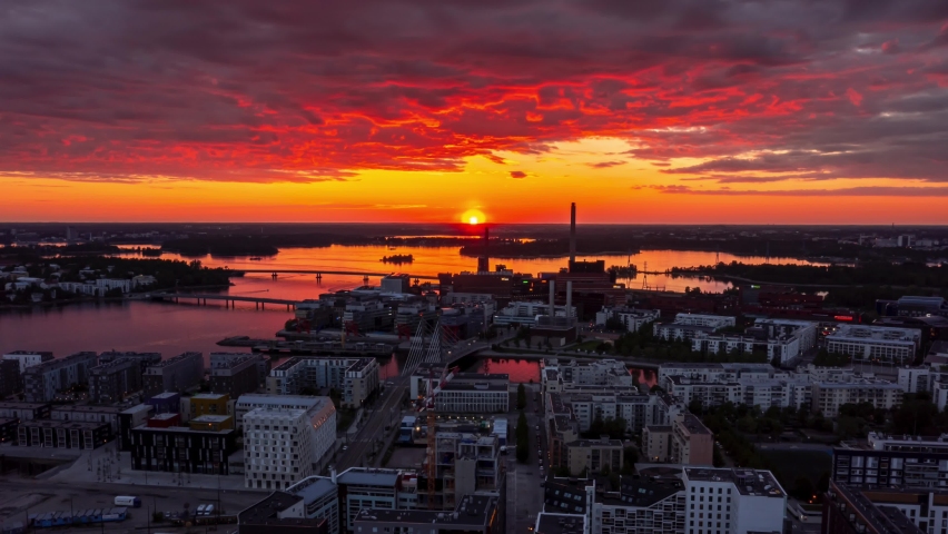 Aerial view of the Jatkasaari neighborhood of Helsinki during the amazing orange sunset. Aerial hyperlapse video.