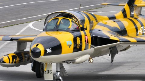 Mollis Switzerland AUGUST, 16, 2019 Close-up view of the cockpit of a military training plane with two seats side by side taxiing. Hawker Hunter jet fighter aircraft of Swiss Air Force in tiger livery