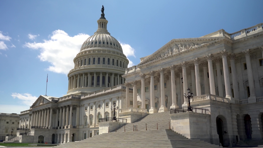 Diagonal motion past the US Capitol on a sunny spring day. Royalty-Free Stock Footage #1075215506