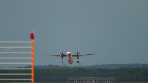 DUSSELDORF, GERMANY - JULY 23, 2017: Airberlin Bombardier DASH 8 picks up speed and takes off, front view