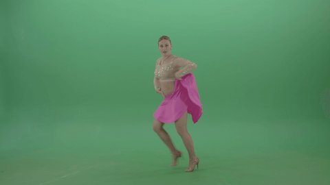 Green screen solo woman performing energetic Latino samba dance. Joyful sport ballroom dancer girl in pink dress solo performing dance moves on green screen footage.