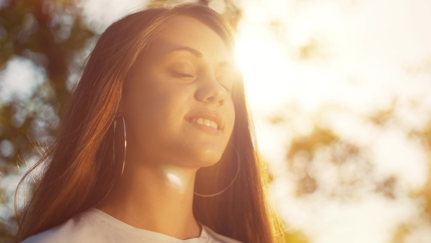 Happy girl teen closed her eyes a dream. girl teenage kid wants a dream come true portrait at sunset. woman daughter silhouette dream of a happy childhood. free face sister closed lifestyle eyes | Shutterstock HD Video #1075232780