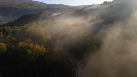 Aerial Shot Of Trees Covered Landscape In Foggy Weather During Autumn - Una National Park, Bosnia and Herzegovina