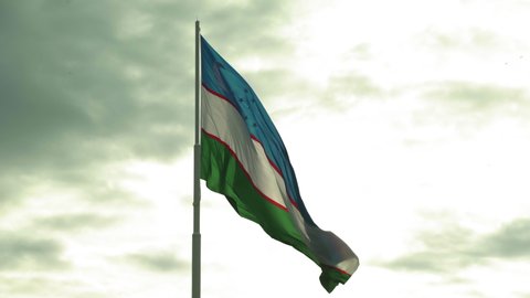 Lockdown Shot Of Flag Of Uzbekistan Waving Against Sky - Tashkent, Uzbekistan