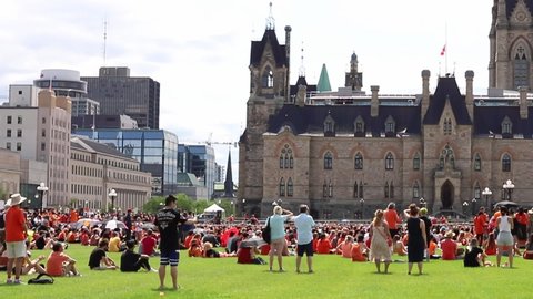 Ottawa, Canada - July 1, 2021: Cancel Canada Day protest rally on Parliament Hill in support of Indigenous people. Every Child Matters. People wearing orange shirts.