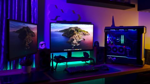 KL, MALAYSIA - July 2nd 2021 :                     4K footage A Work From Home Office Setup. HTPC, Hackintosh PC  Gaming PC rig with liquid cooling setup and full RGB light inside 