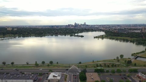 Sloan's Lake, Denver, Colorado USA. Aerial View of Downtown From Park Revealing Eaglewood and Northeast Lakewood Neighborhood, Dolly Drone Shot
