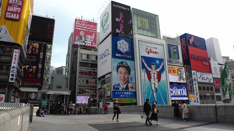 OSAKA, JAPAN - APRIL 2021 : View around central downtown area Namba, Dotonbori and Shinsaibashi shopping street. Normally busy, but lightly populated due to concerns over Coronavirus (COVID-19).