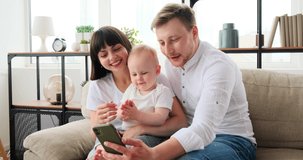 Happy family doing video call using mobile phone