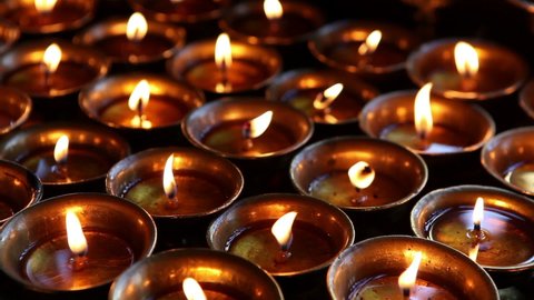 Butter oil candles burning in Swayambhunath temple in Kathmandu, Nepal. Tibetan Buddhism is the traditional religion in this Buddhist temple.