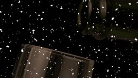 Animation of confetti falling and champagne being poured into glass. global celebration, new year's eve and party concept digitally generated video.