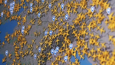 Busy air traffic over map of Europe, time lapse with many routes of commercial airplanes