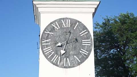 Clock tower in old town. Historical building. Novi Sad, Serbia. Concept of time.