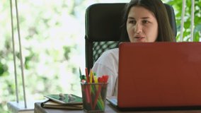 Excited young woman winner looks at laptop celebrates online success . Euphoric lady gets new distance job opportunity, reads good news in email, rejoices victory, feels motivated.