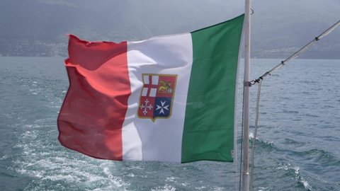 Close-Up Italian flag waving in slow-motion on the back of a cruise ship.
