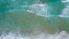 Aerial view of drone. Full frame of beach sand and sea. High Quality Nature Video Landscape Aerial View Beach Sea. On Good Weather Day In Summer Travel. Phuket travel trip Andaman sea On June 2021.
