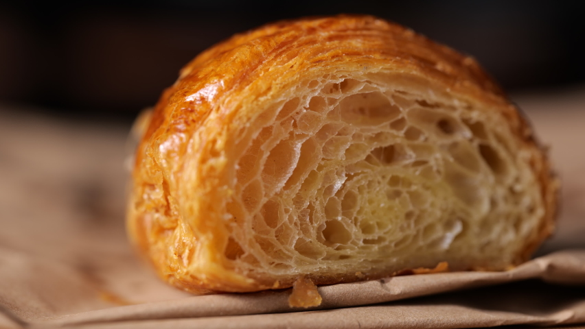 Cut freshly croissant rotation in slow motion Royalty-Free Stock Footage #1075327847