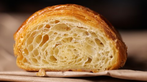 Cut freshly croissant rotation in slow motion