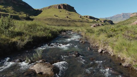 Aerial POV flying up the Bushman's River at Giant's Castle, Drakensberg, South Africa. Fresh clean Water 