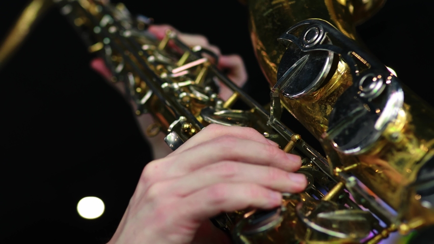 student learning to play on saxophone in the room Royalty-Free Stock Footage #1075341035