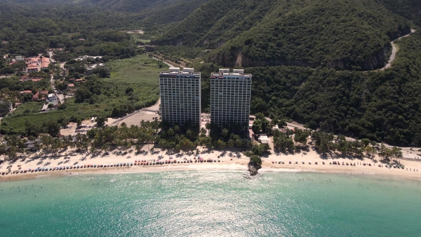 
Two large towers in the middle of a beautiful beach on the Venezuelan coast.
